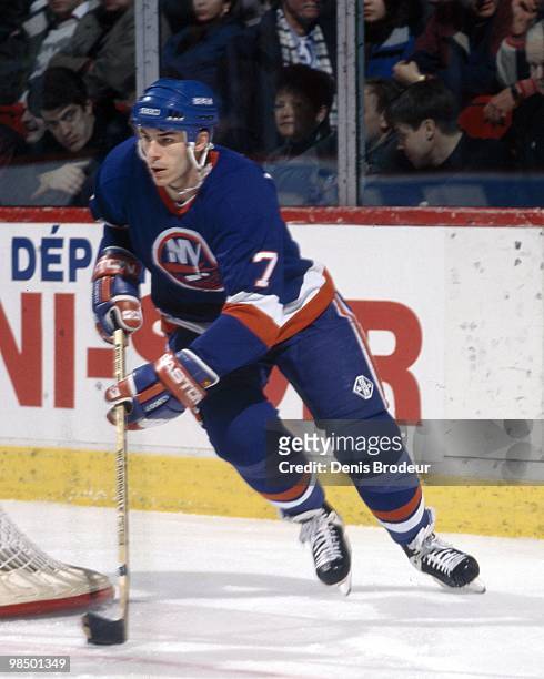 Scott Lachance of the New York Islanders skates with the puck against the Montreal Canadiens in the 1990's at the Montreal Forum in Montreal, Quebec,...