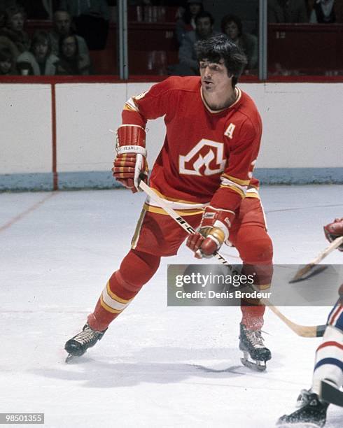 Pat Quinn of the Atlanta Flames skates against the Montreal Canadiens in the 1970's at the Montreal Forum in Montreal, Quebec, Canada.