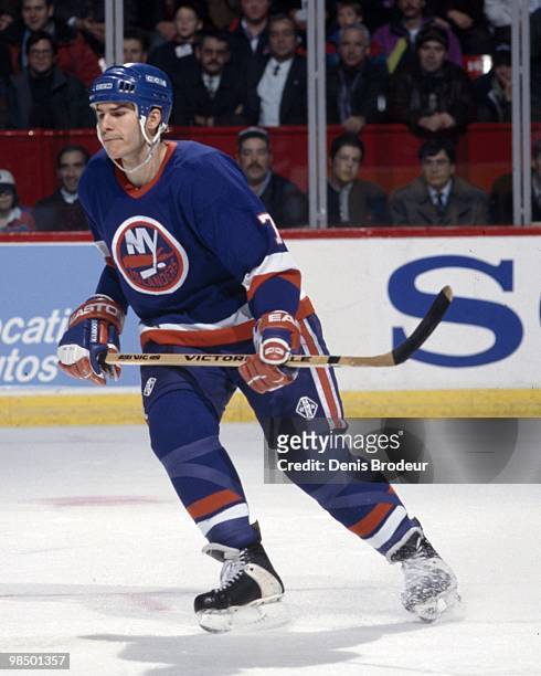 Scott Lachance of the New York Islanders skates against the Montreal Canadiens in the 1990's at the Montreal Forum in Montreal, Quebec, Canada.