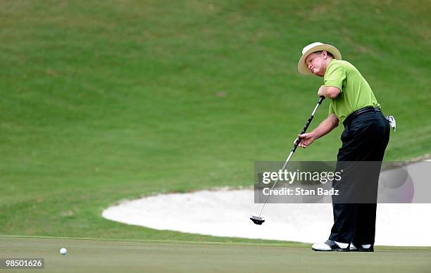 Tom Kite hits a putt on the 18th green during the first round of the Outback Steakhouse Pro-Am at TPC Tampa Bay on April 16, 2010 in Lutz, Florida.