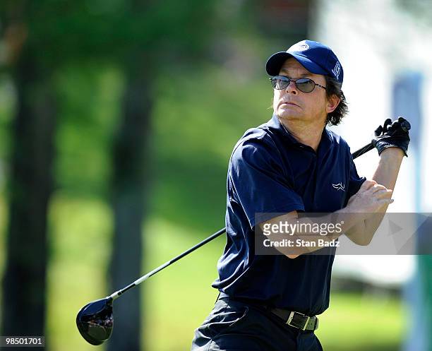 Actor Michael J. Fox hits from the 18th tee box during the first round of the Outback Steakhouse Pro-Am at TPC Tampa Bay on April 16, 2010 in Lutz,...