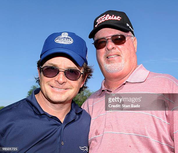 Actor Michael J. Fox, left, and Champions Tour player Tim Simpson, right, posed for a photo during the first round of the Outback Steakhouse Pro-Am...