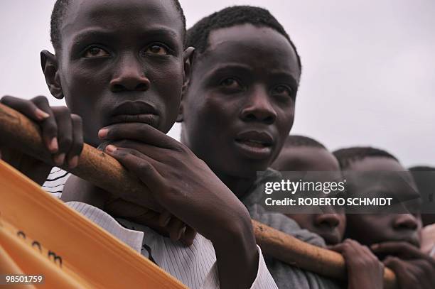 Children living in the western Ugandan town of Fort Portal, attend a ceremony in which King Oyo Nyimba Kabamba Iguru Rukidi IV presented the winners...