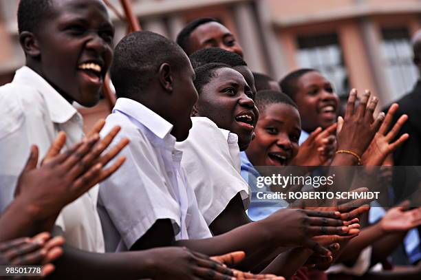 School girls clap and sing as they wait to greet King Oyo Nyimba Kabamba Iguru Rukidi IV on April 16, 2010. Oyo is a teen king that rules over more...