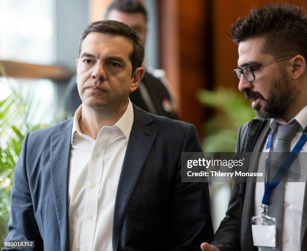 Greece Prime Minister Alexis Tsipras is talking with the diplomatic advisor Vangelis Kalpadakisat at the end of an informal working meeting on...