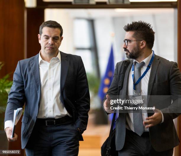 Greece Prime Minister Alexis Tsipras is talking with the diplomatic advisor Vangelis Kalpadakisat at the end of an informal working meeting on...