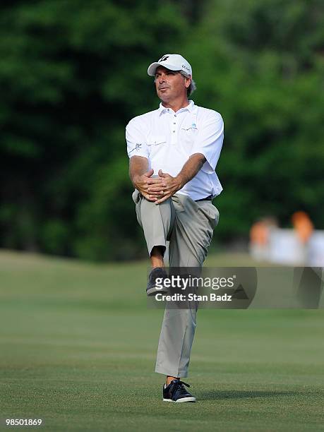Fred Couples waits for play on the 16th fairway during the first round of the Outback Steakhouse Pro-Am at TPC Tampa Bay on April 16, 2010 in Lutz,...