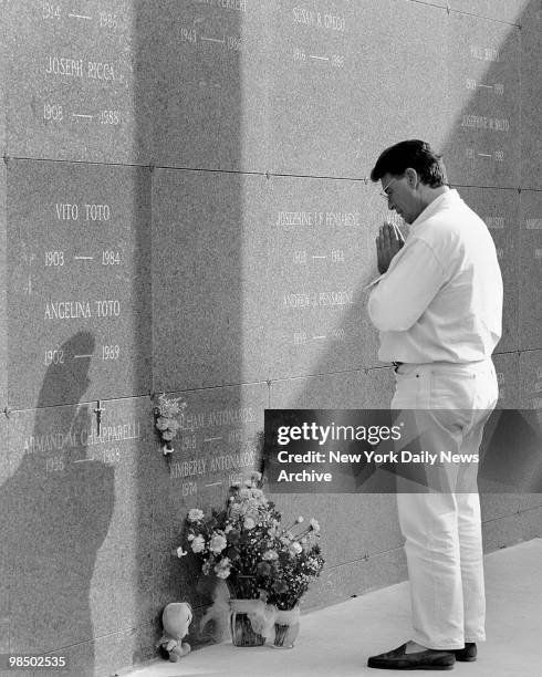 Thomas Antonakos, father of Kimberly Antonakos, prays at her grave at cemetary on Staten Island in a photo taken on September 7, 1995. Joshua Torres...