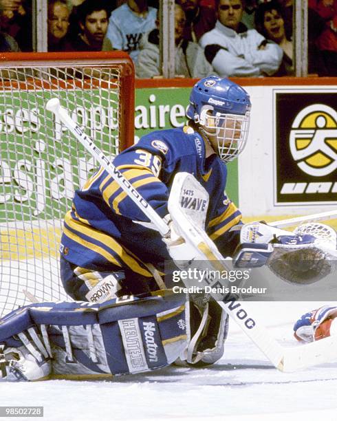 Goaltender Dominik Hasek of the Buffalo Sabres protects the net against the Montreal Canadiens in the 1990's at the Montreal Forum in Montreal,...