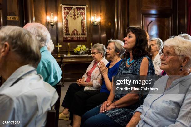 side view of people sitting in church - bible side view stock pictures, royalty-free photos & images