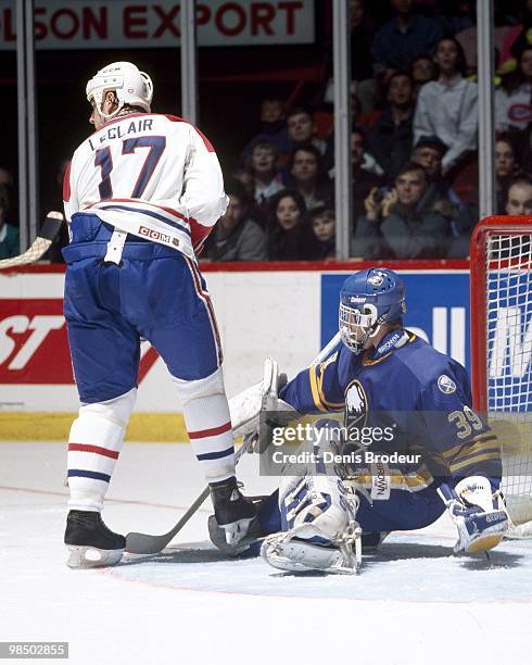 Goaltender Dominik Hasek of the Buffalo Sabres protects the net against John LeClair of the Montreal Canadiens in the 1990's at the Montreal Forum in...