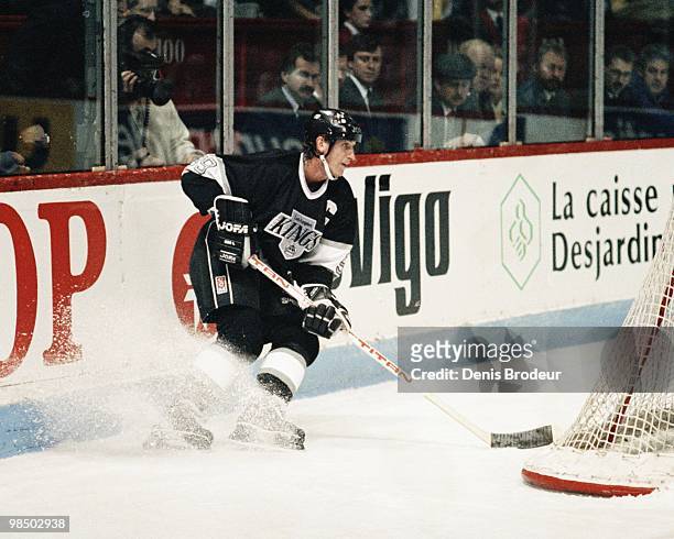Wayne Gretzky of the Los Angeles Kings skates behind the net against the Montreal Canadiens in the 1990's at the Montreal Forum in Montreal, Quebec,...