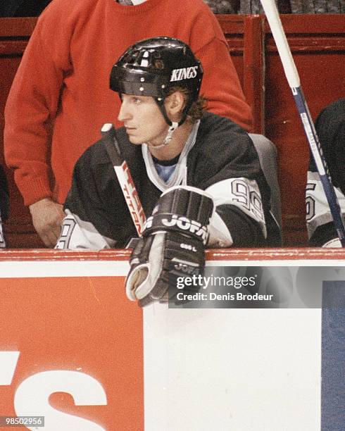 Wayne Gretzky of the Los Angeles Kings sits on the bench during the game against the Montreal Canadiens in the 1990's at the Montreal Forum in...