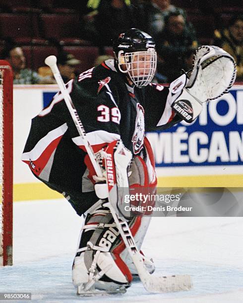 Goaltender Dominik Hasek of the Buffalo Sabres protects the net against the Montreal Canadiens in the 1990's at the Montreal Forum in Montreal,...