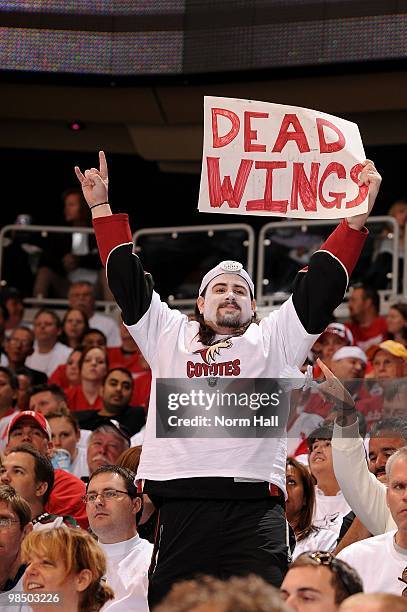 Phoenix Coyotes fan holds up a sign that taunts the Detroit Red Wings fans in Game One of the Western Conference Quarterfinals during the 2010 NHL...