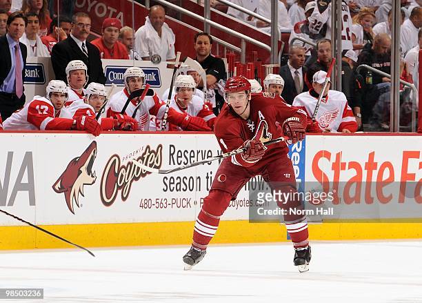 Zbynek Michalek of the Phoenix Coyotes dumps the puck down ice against the Detroit Red Wings in Game One of the Western Conference Quarterfinals...