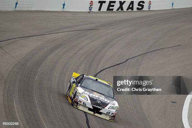 David Reutimann, driver of the Aaron's Dream Machine Toyota, drives on track during practice for the NASCAR Sprint Cup Series Samsung Mobile 500 at...