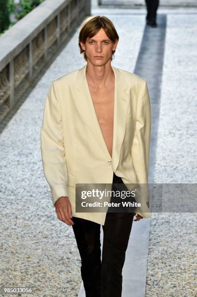 Model walks the runway during the Dunhill London Menswear Spring/Summer 2019 show as part of Paris Fashion Week on June 24, 2018 in Paris, France.