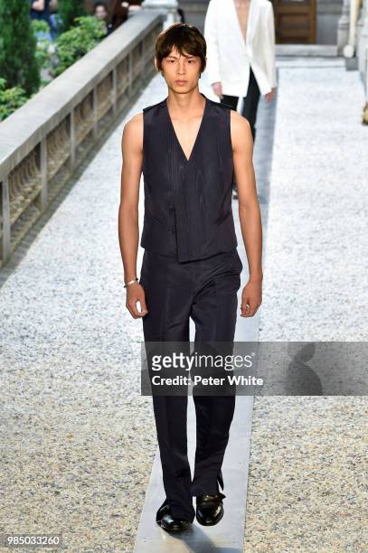 Model walks the runway during the Dunhill London Menswear Spring/Summer 2019 show as part of Paris Fashion Week on June 24, 2018 in Paris, France.