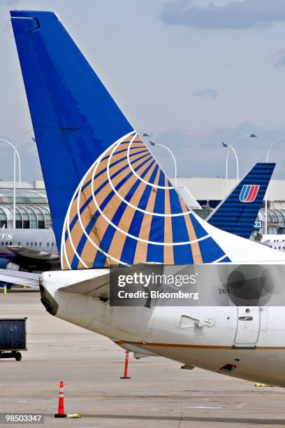 Continental Airlines jet, foreground, is parked near a United Airlines jet at O'Hare International Airport in Chicago, Illinois, U.S., on Friday,...