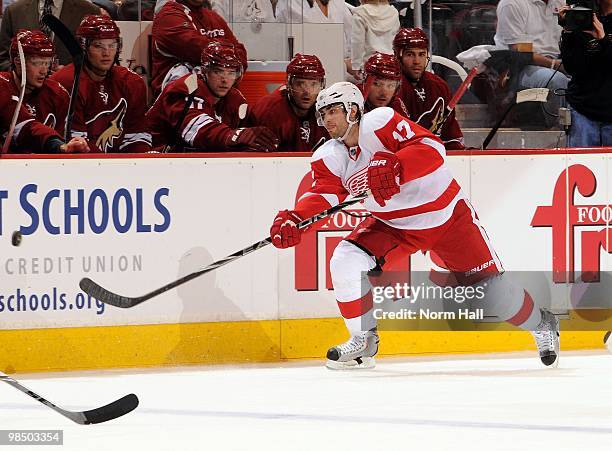 Patrick Eaves of the Detroit Red Wings fires the puck up ice along the boards against the Phoenix Coyotes in Game One of the Western Conference...