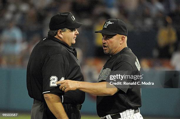 Manager Fredi Gonzalez of the Florida Marlins speaks with umpire Jerry Layne during a MLB game against the Los Angeles Dodgers at Sun Life Stadium on...