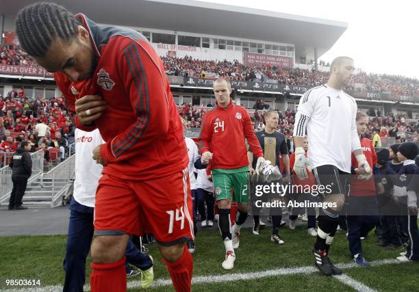 Newly named captain Dwayne DeRosario of Toronto FC takes to the new grass fiels before playing Philadelphia Union during action at BMO Field April...