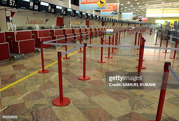 The check-in counters at the international airport of Schwechat are empty on April 16, 2010 some 25 kilometers east from Vienna .A cloud of ash from...
