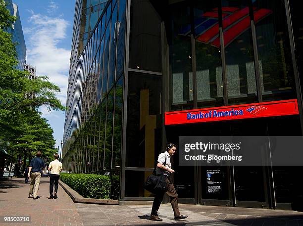 Pedestrians walk near a Bank of America Corp. Branch in Charlotte, North Carolina, U.S., on Friday, April 16, 2010. Bank of America Corp., whose...