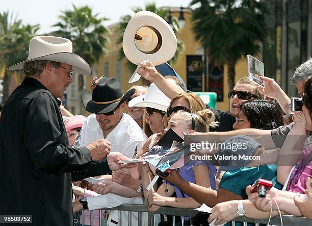 Country singer Alan Jackson signs autographs at his Hollywood Walk Of Fame Induction Ceremony on April 16, 2010 in Hollywood, California.