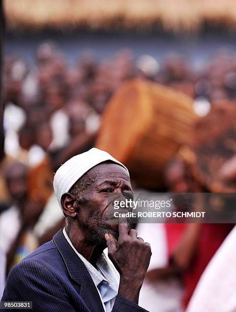 An elder of a Toroo delegation looks at King Oyo Nyimba Kabamba Iguru Rukidi IV during a ceremony in his honor as a delegation of the Toroo Kingdom...