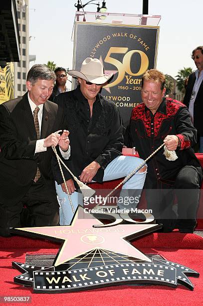 Hollywood Chamber of Commerce president/CEO Leron Gubler , country singer Alan Jackson and KKGO Radio Personality Shawn Parr attend the Alan Jackson...