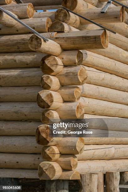 Log home made of custom-cut cedar trees is being constructed at the Montana Log Homes manufacturing site before being delivered and reconstructed at...