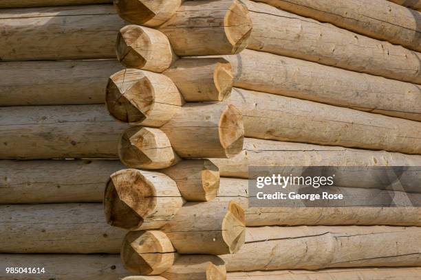 Log home made of custom-cut cedar trees is being constructed at the Montana Log Homes manufacturing site before being delivered and reconstructed at...