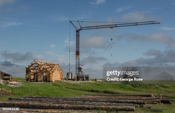 Log home made of custom-cut cedar trees is being constructed at the Montana Log Homes manufacturing site before being delivered and reconstructed at...