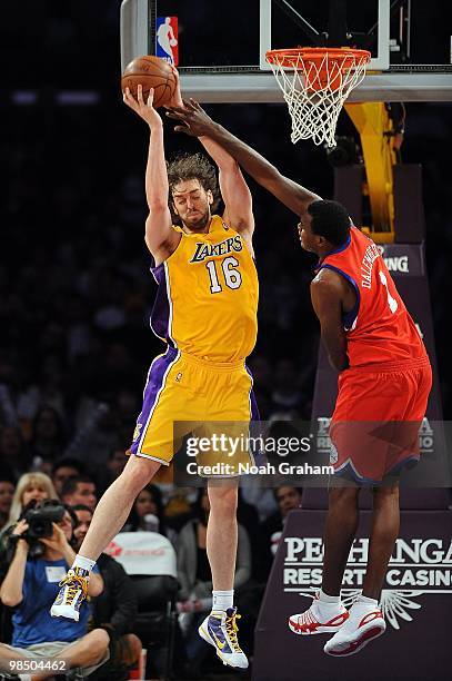 Pau Gasol of the Los Angeles Lakers rebounds against Samuel Dalembert of the Philadelphia 76ers during the game on February 26, 2010 at Staples...