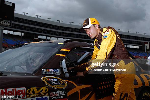 David Ragan, driver of the UPS Ford, gets out of his car after qualifying for the NASCAR Sprint Cup Series Samsung Mobile 500 at Texas Motor Speedway...