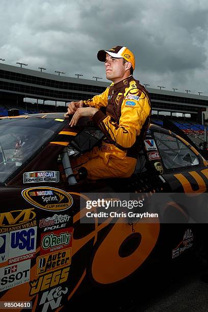 David Ragan, driver of the UPS Ford, gets out of his car after qualifying for the NASCAR Sprint Cup Series Samsung Mobile 500 at Texas Motor Speedway...