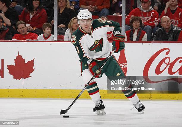 Marek Zidlicky of the Minnesota Wild plays the puck against the Detroit Red Wings during their NHL game on March 11, 2010 at Joe Louis Arena in...