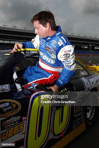 David Reutimann, driver of the Aaron's Dream Machine Toyota, gets out of his car after qualifying for the NASCAR Sprint Cup Series Samsung Mobile 500...