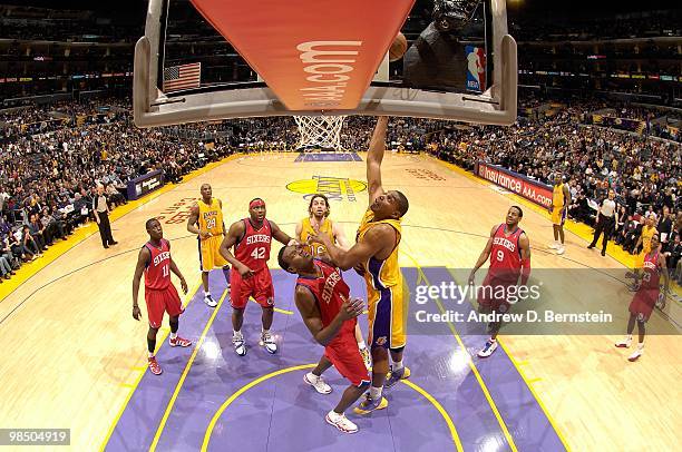 Andrew Bynum of the Los Angeles Lakers goes to the basket against Samuel Dalembert of the Philadelphia 76ers on February 26, 2010 at Staples Center...