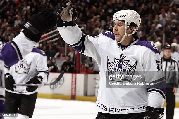 Alexander Frolov of the Los Angeles Kings gives a high five to a teammate after a goal against the Anaheim Ducks during the game on April 6, 2010 at...