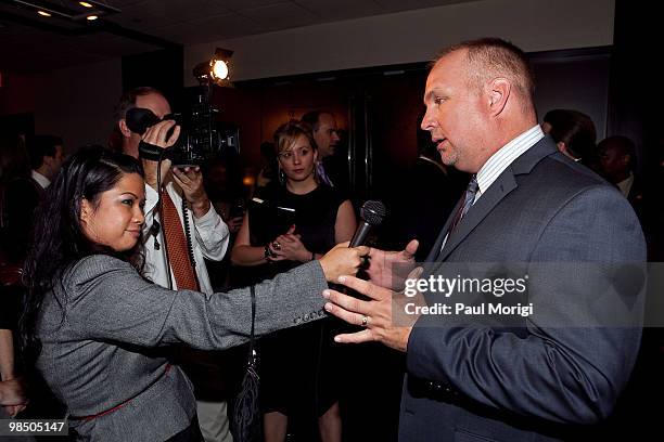 Garth Brooks is interviewed at the GRAMMYs on the Hill awards at The Liaison Capitol Hill Hotel on April 14, 2010 in Washington, DC.