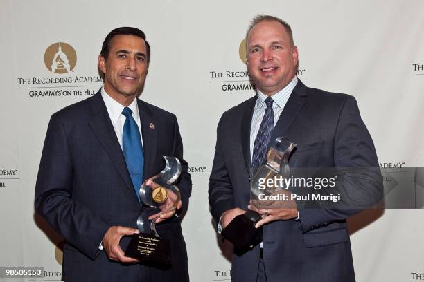 Honorees Darryl Issan and Garth Brooks pose for a photo at the GRAMMYs on the Hill awards at The Liaison Capitol Hill Hotel on April 14, 2010 in...