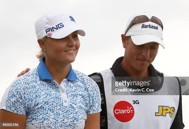 Anna Nordqvist of Sweden reacts with her caddie after sinking her putt to win The Mojo 6 Jamaica LPGA Invitational at Cinnamon Hill Golf Course on...