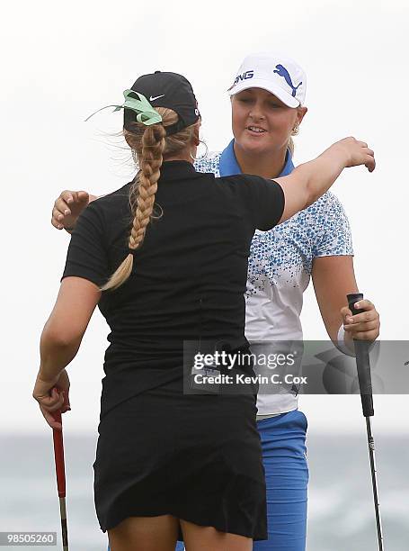 Anna Nordqvist of Sweden is congratulated by Amanda Blumenherst of the United States after defeating her to win The Mojo 6 Jamaica LPGA Invitational...