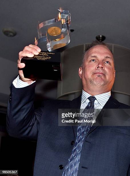 Musician and honoree Garth Brooks with his award at the GRAMMYs on the Hill awards at The Liaison Capitol Hill Hotel on April 14, 2010 in Washington,...