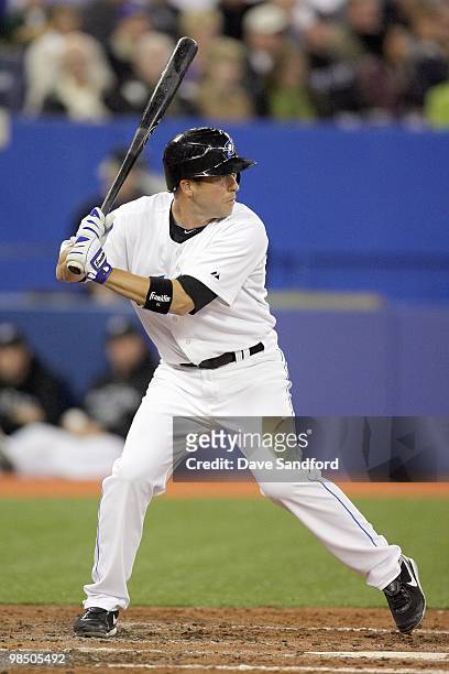 John McDonald of the Toronto Blue Jays steps into the swing during the game against the Chicago White Sox at the Rogers Centre on April 12, 2010 in...