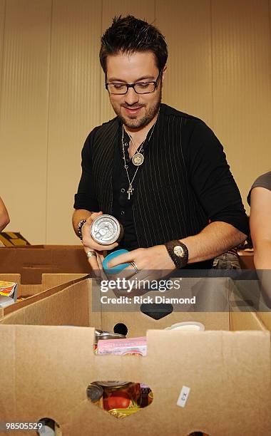 Former American Idol Danny Gokey volunteers ar part of The American Idol Gives Back Program at The Three Square Food Bank on April 16, 2010 in Las...