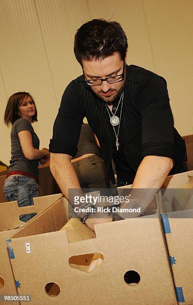 Former American Idol Danny Gokey volunteers ar part of The American Idol Gives Back Program at The Three Square Food Bank on April 16, 2010 in Las...